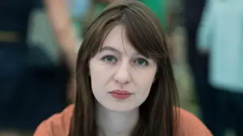 Irish author Sally Rooney claims she cannot travel to the UK because of potential arrest